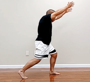 Warrior 1 pose is a good yoga pose for back pain