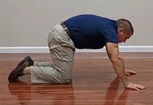 Lower Back Pain Cat Cow Exercise On Hands And Knees, upward flexion movement