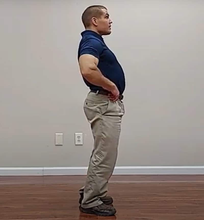 standing backward bending McKenzie exercise lower back pain stretch
