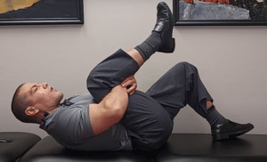 single knee to chest lumbar flexion exercise to relieve disc pain