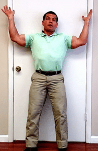 back to wall chest stretch can help treat kyphosis with lordosis