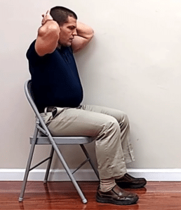 The seated back extension exercise can also help you walk without leaning over.