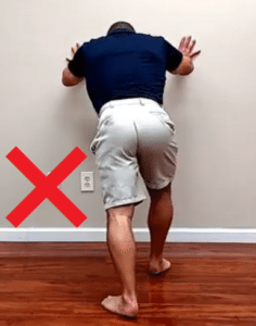 The wrong way to stretch tight calves (rear view)