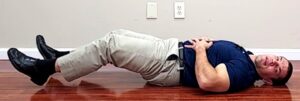 Abdominal exercise for back pain - double leg raises ending position