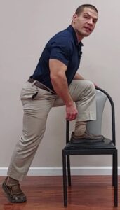 Foot on chair step up exercise to help get up from the floor with bad knees