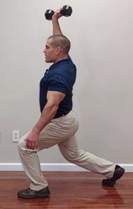 Overhead dumbbell lunge exercise