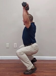 Overhead dumbbell squat exercise