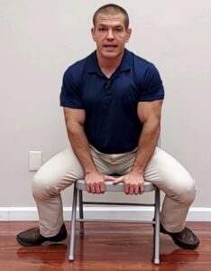 Seated hip adductor stretch