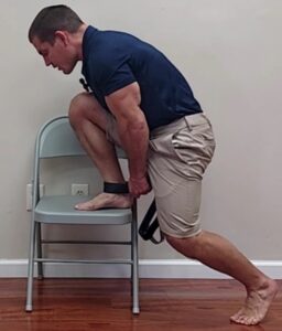 ankle joint mobilization on chair with pull up band