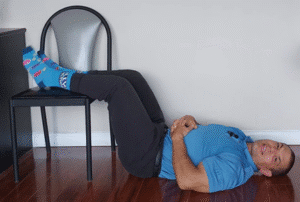 supine feet on chair spinal decompression technique